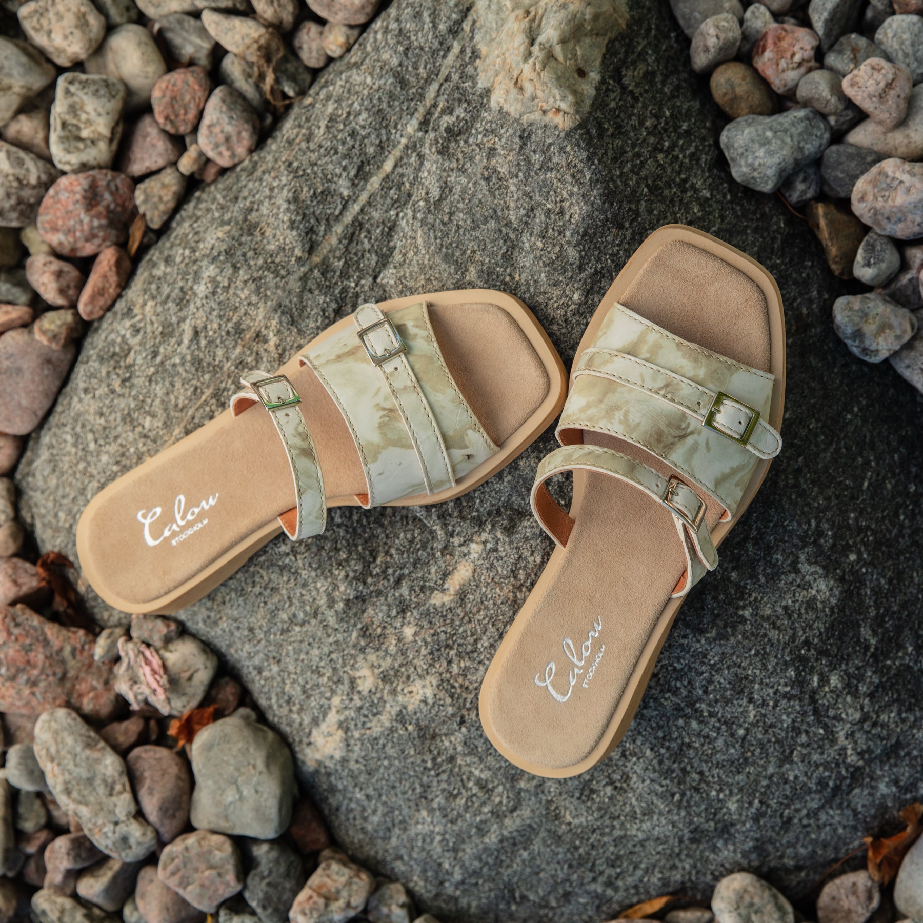 Christa beige clog sandals on rock Calou Stockholm