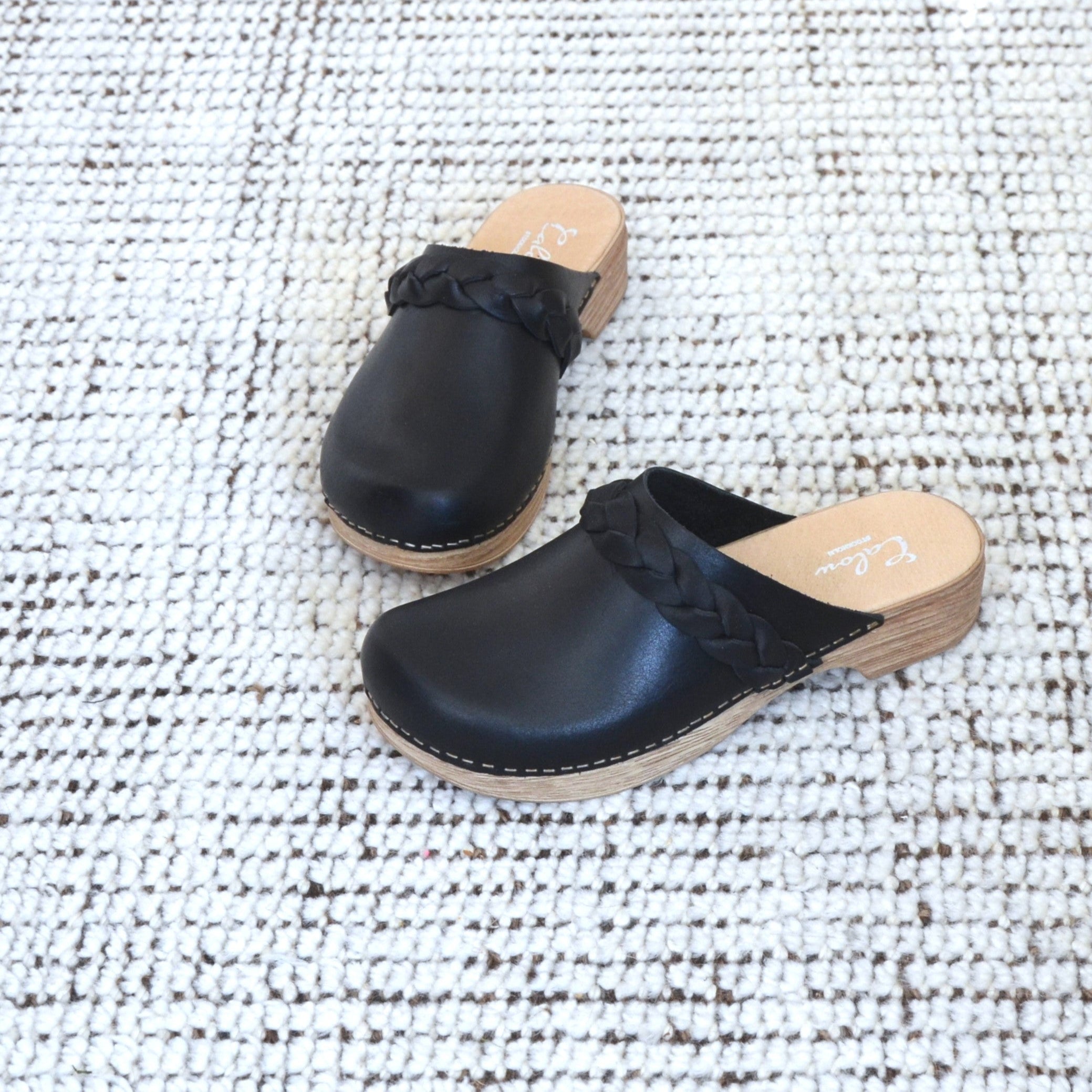 Helena black leather clogs on carpet calou stockholm