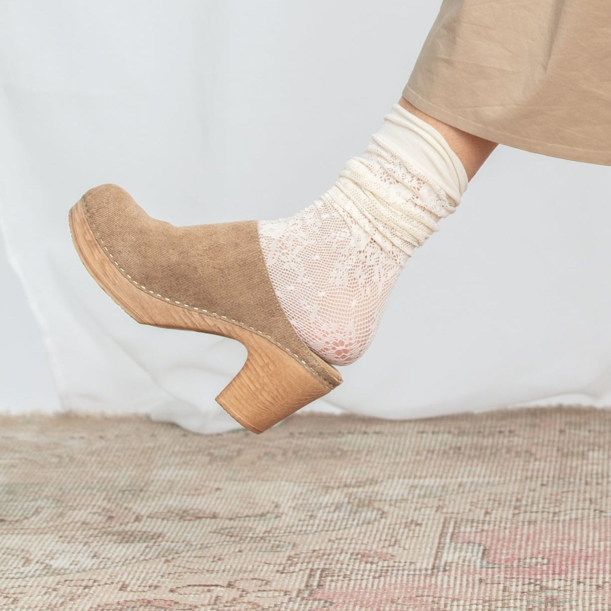 Lisa beige suede high heeled clog on model Calou Stockholm