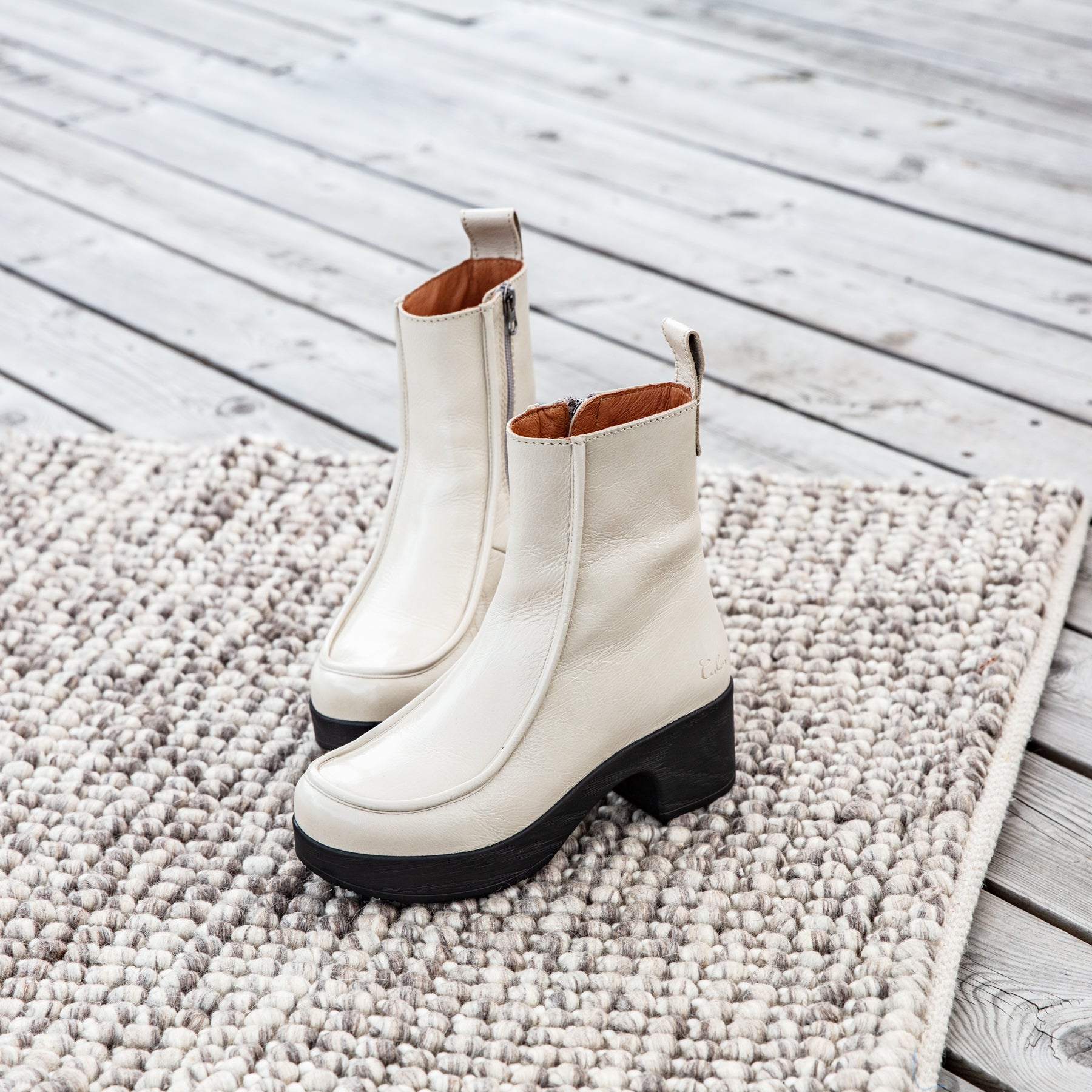 Viola white patent leather clog boots on carpet Calou