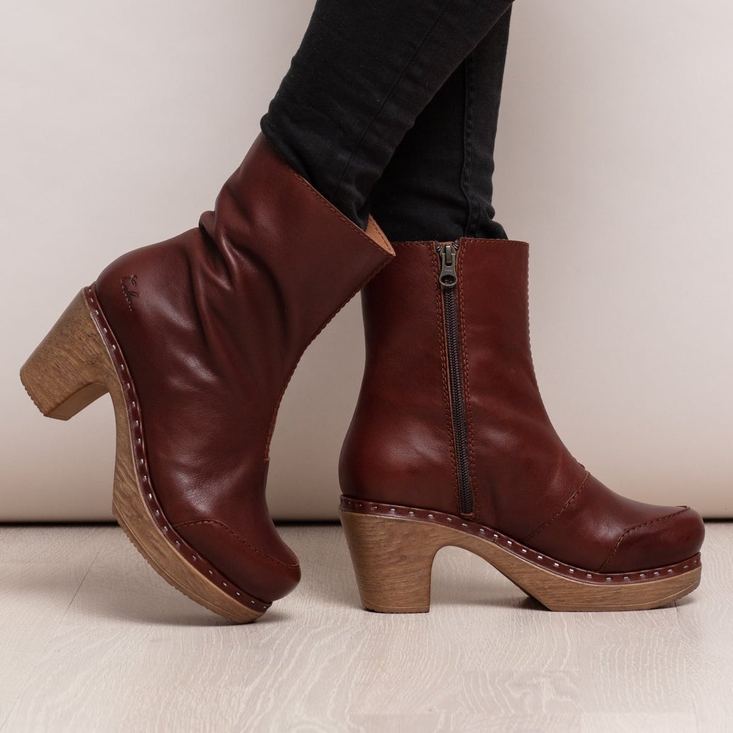 Milly cognac leather clog boots on model Calou