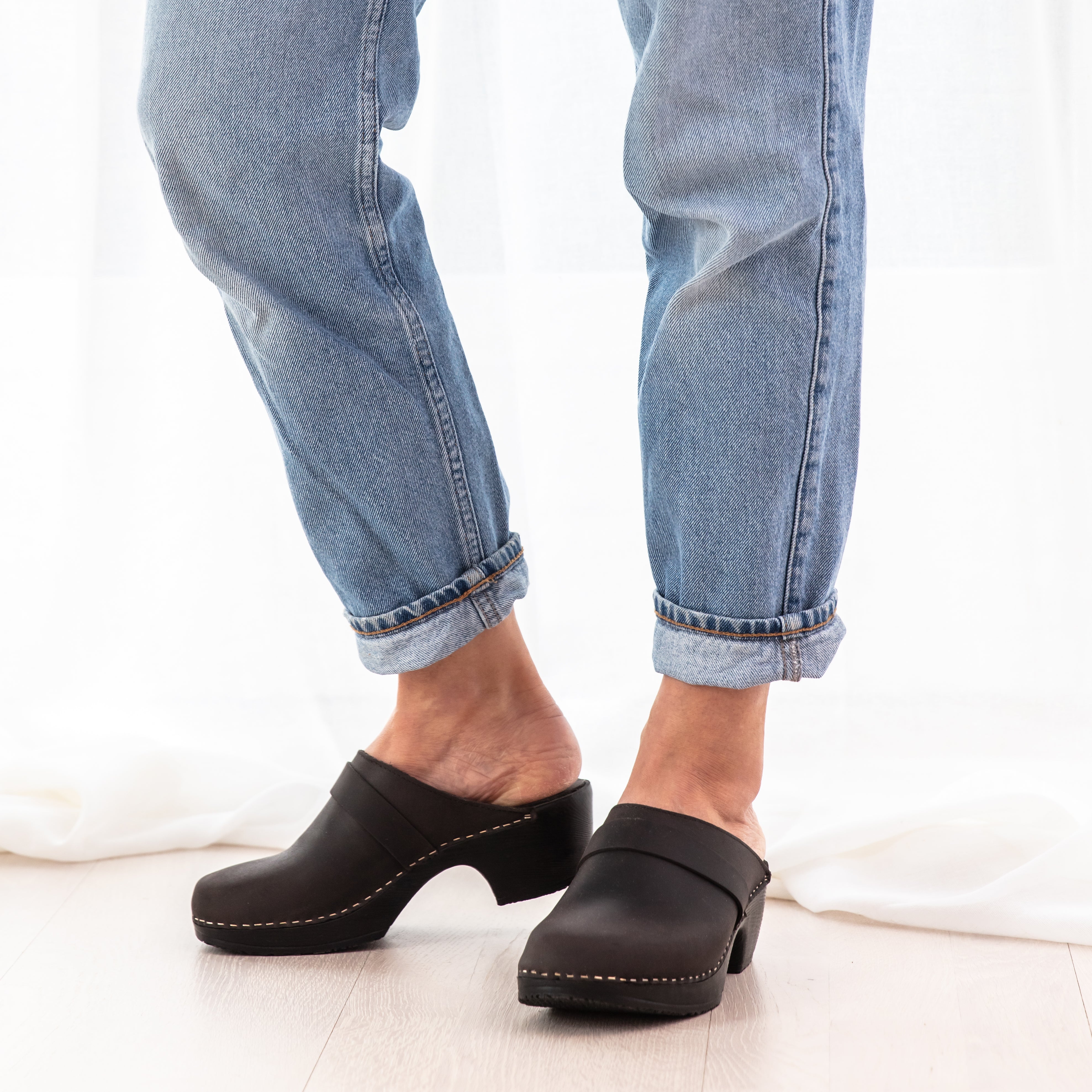 Annika black leather clog on model Calou