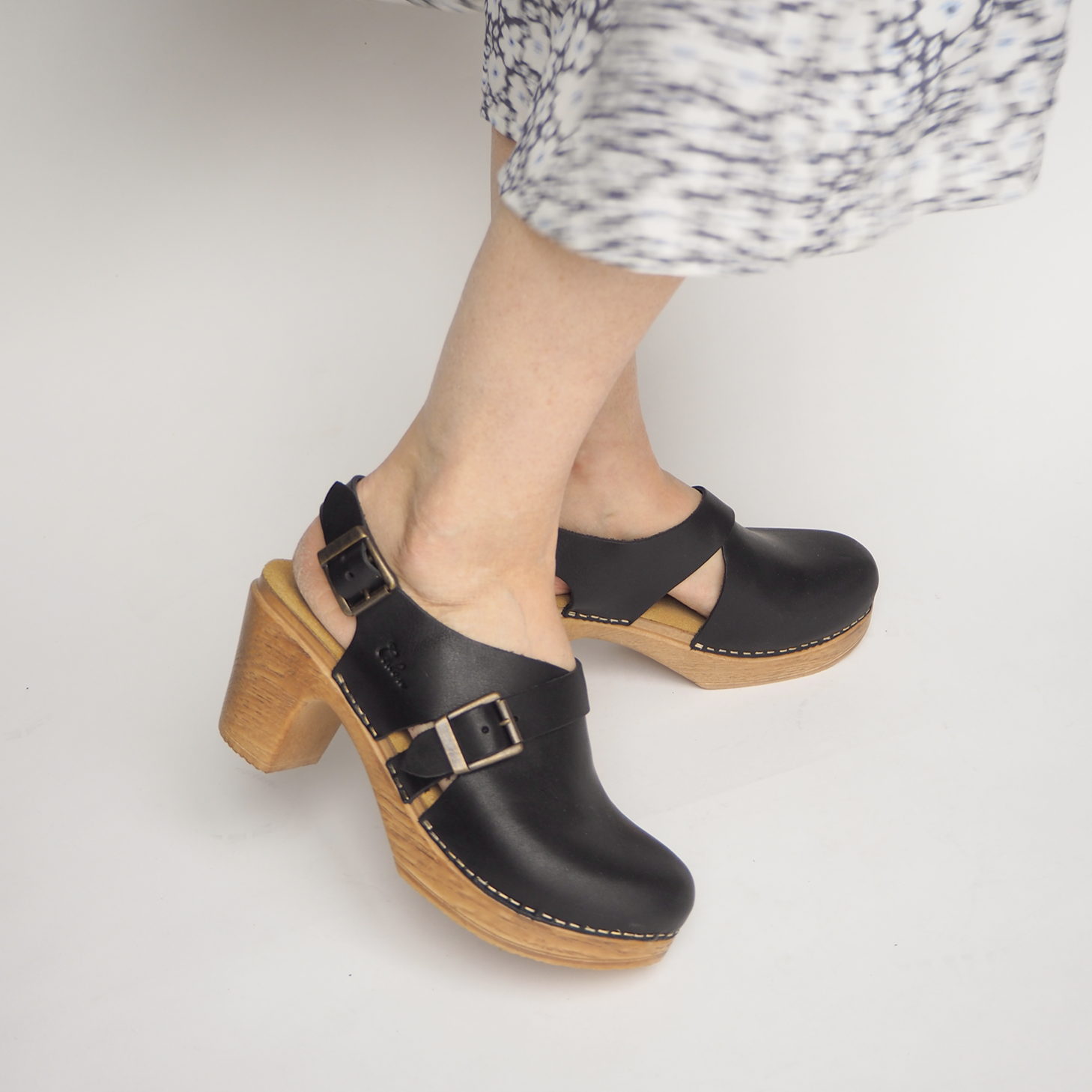 Astrid black leather clog on model Calou Stockholm