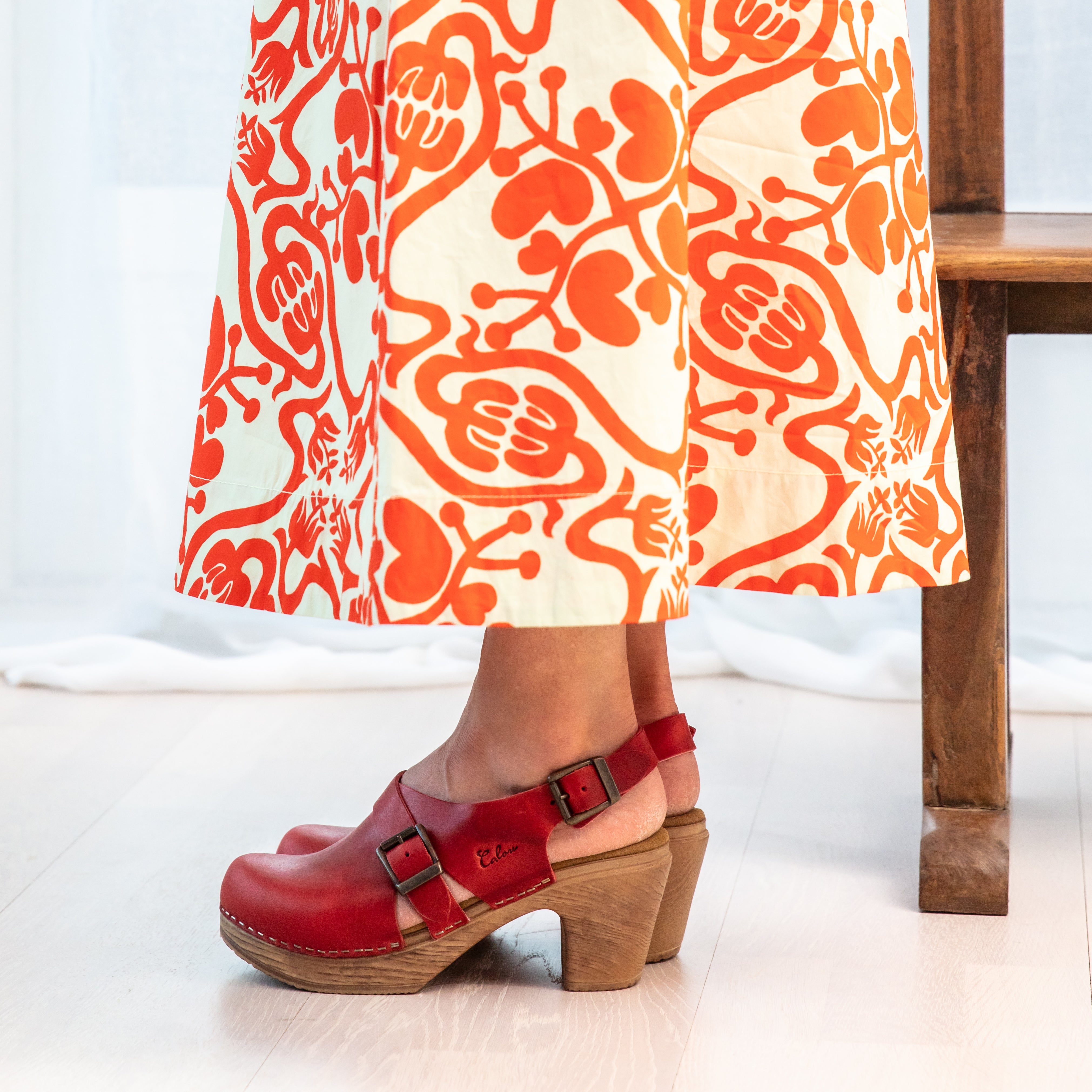 Astrid red leather slingback clog on model Calou Stockholm