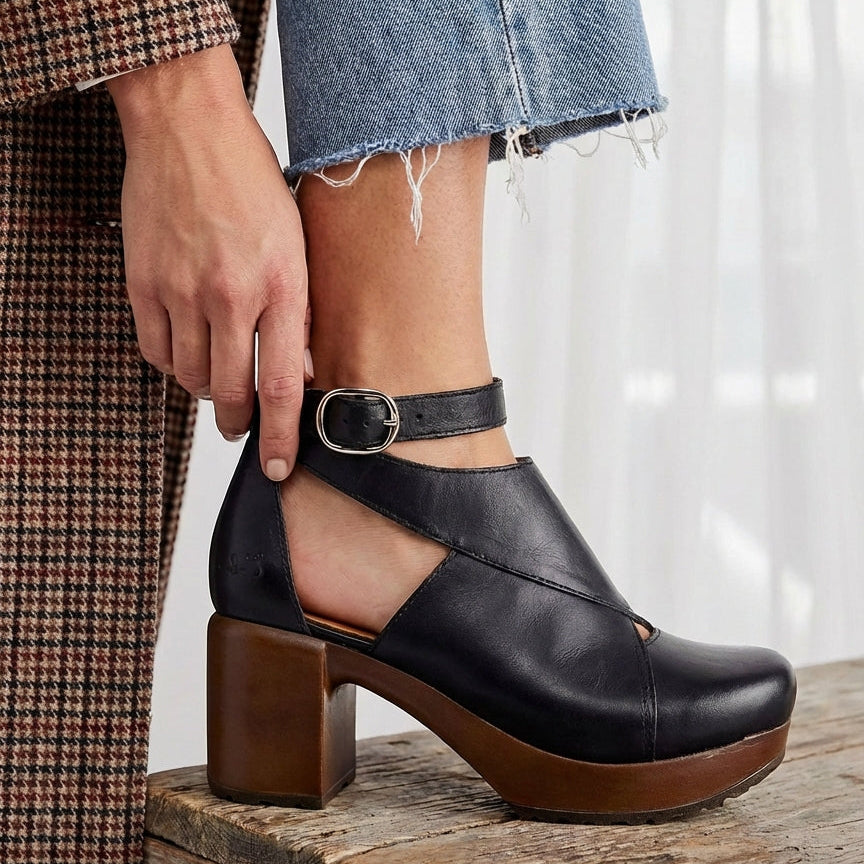 Black leather clog with soft flexible sole on model