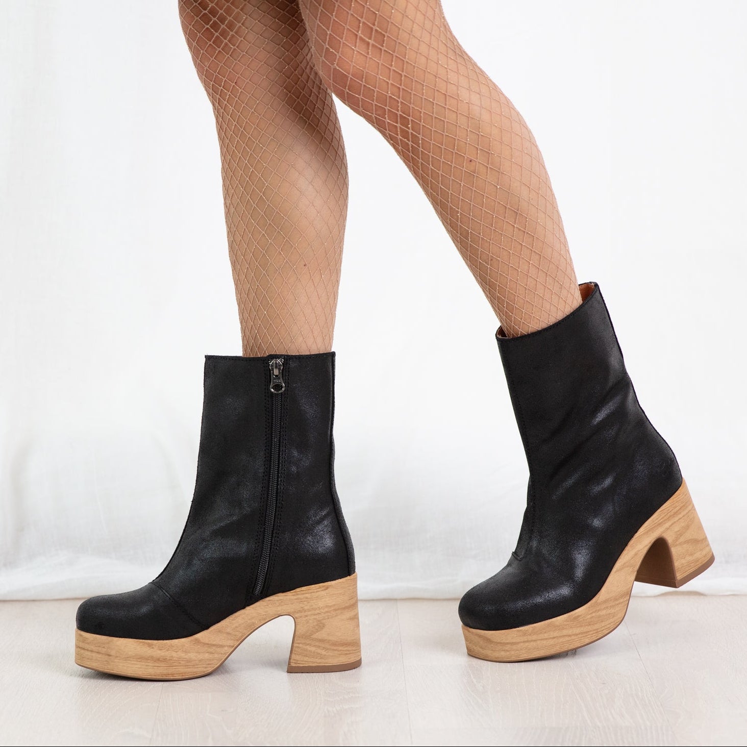 Bobbie black leather clog boots on model Calou