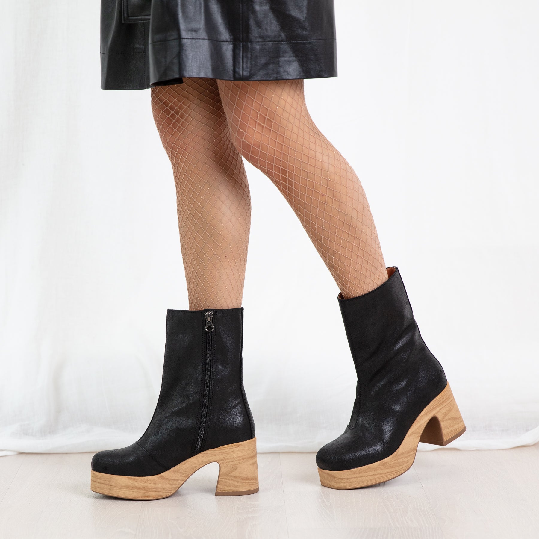 Bobbie black leather clog boots on model Calou