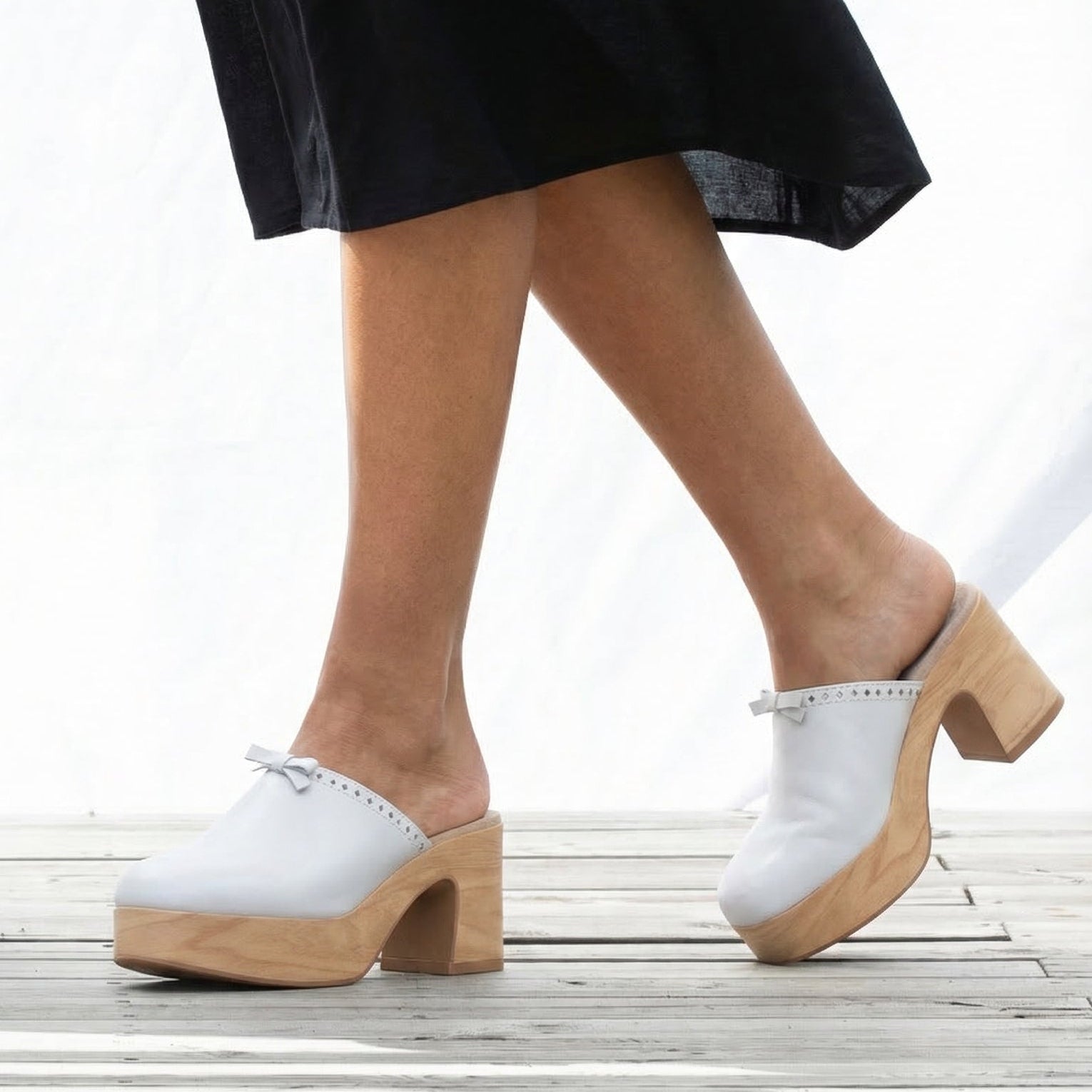 Calou white heeled women clogs on soft flexible soles 