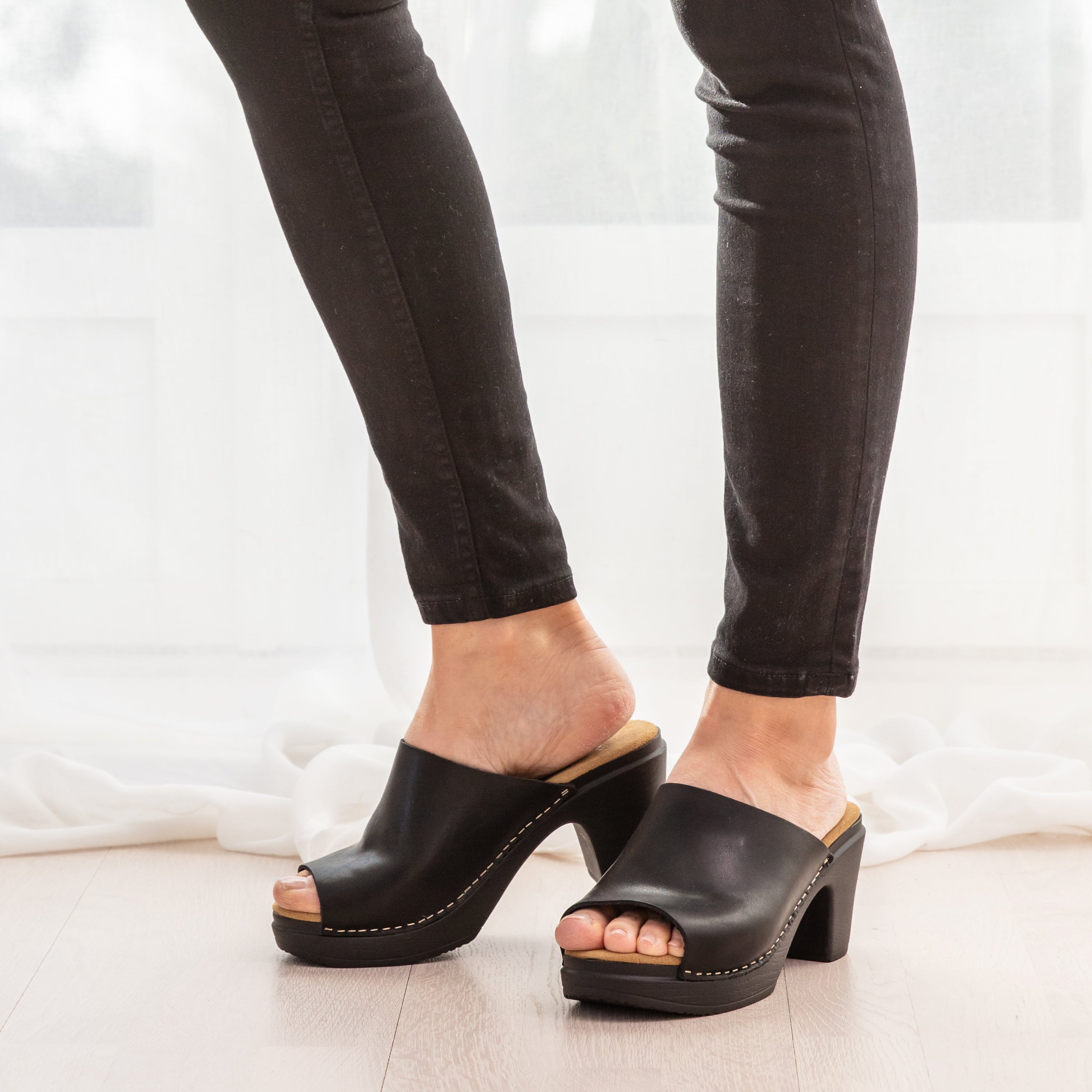 Frida black leather clog sandal on model calou stockholm