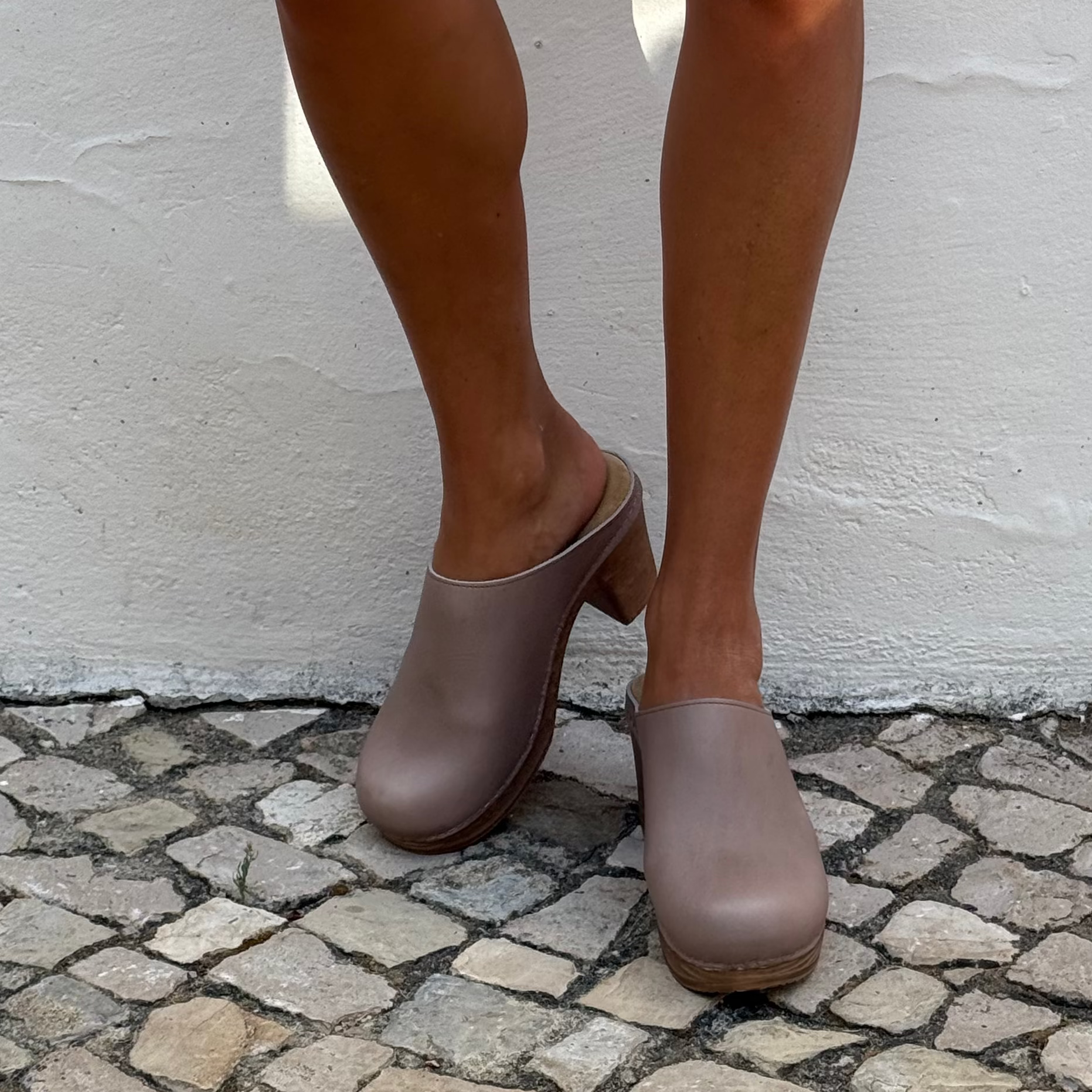 Calou taupe leather clogs on model. Lifestyle