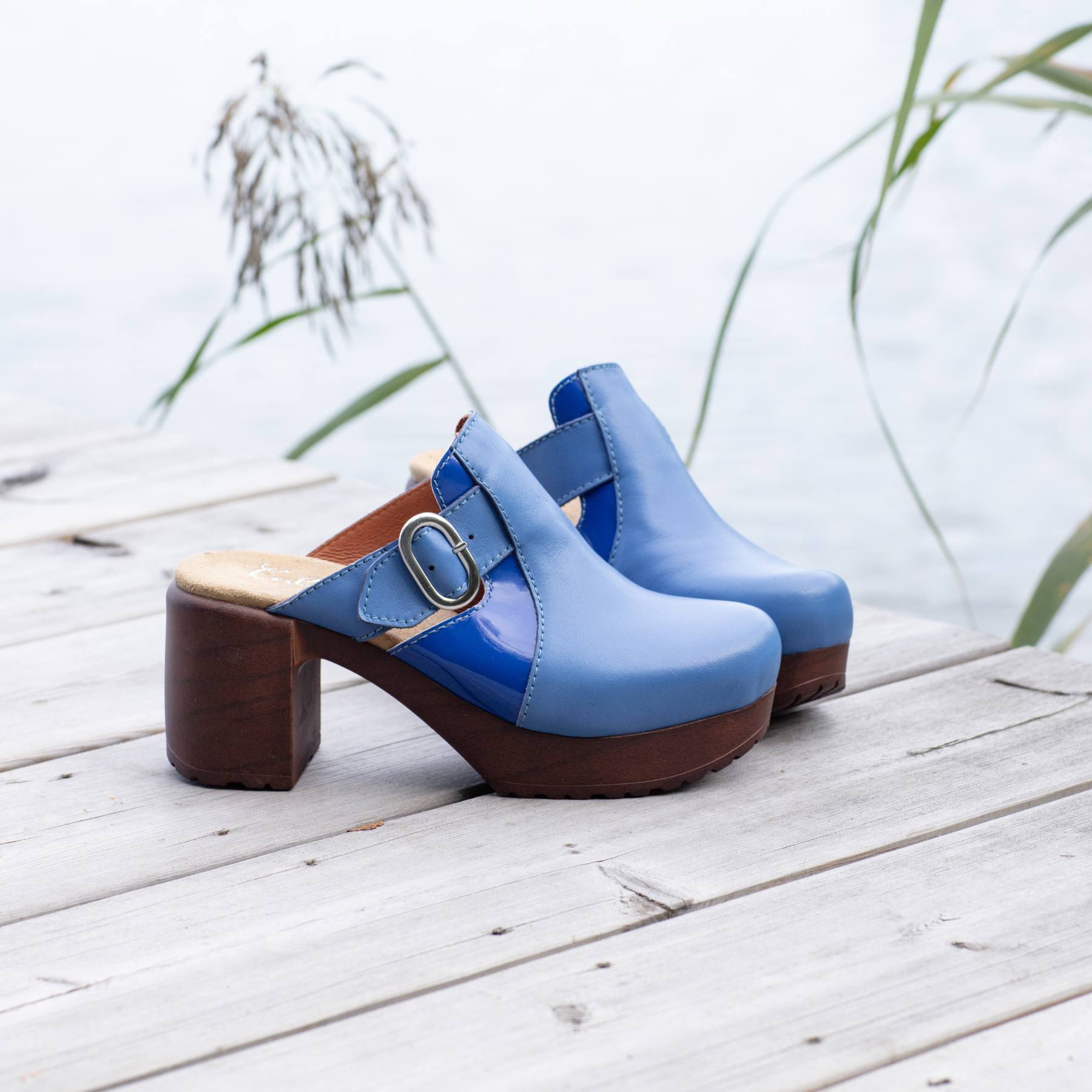 Sonja blue leather clogs on pier, Calou Stockholm