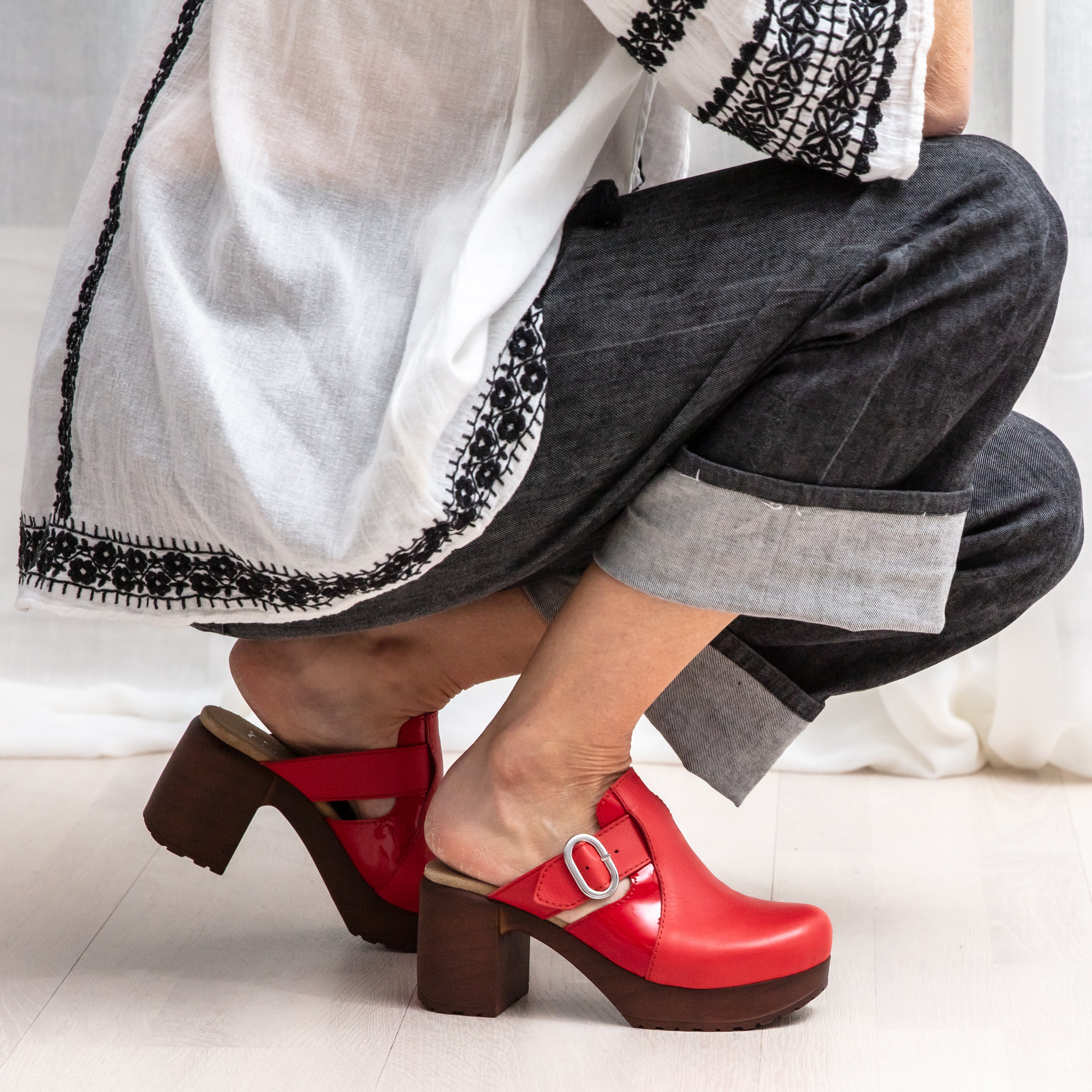 Sonja red leather clog on model, Calou Stockholm